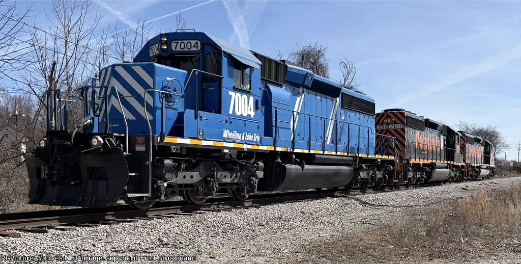 WE 7004 & Co. motor out of the yard toward Summit St.